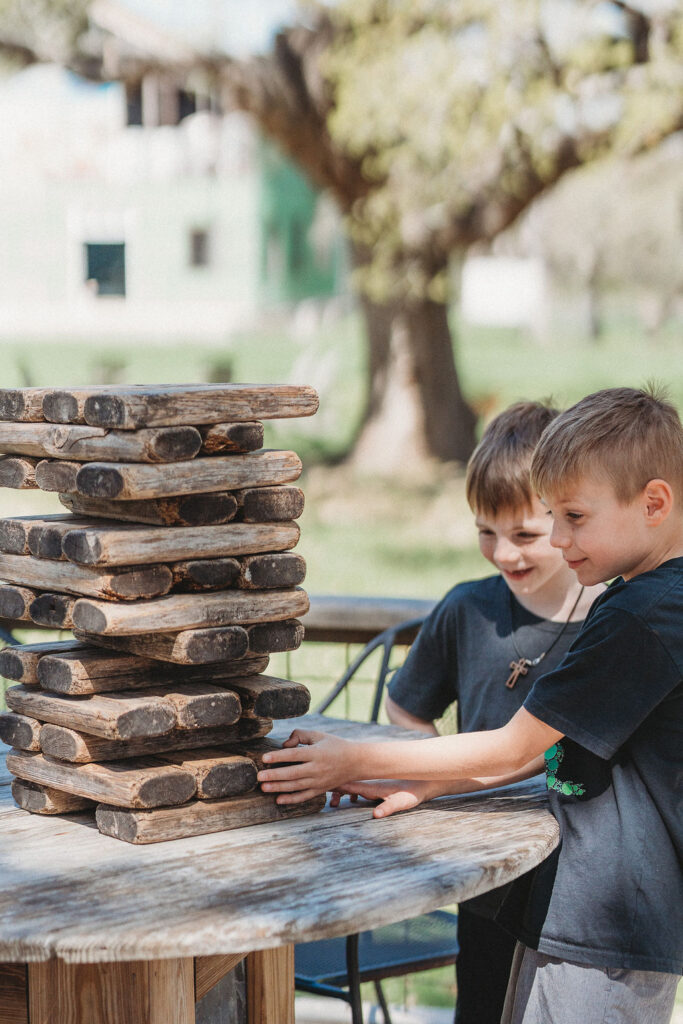 Kids playing Jenga at Wimberley Restaurant